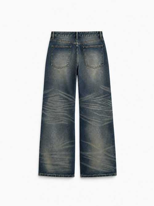 Button Fly Baggy Jeans in Iron Indigo. Back view, showing rear pockets and whiskered denim.