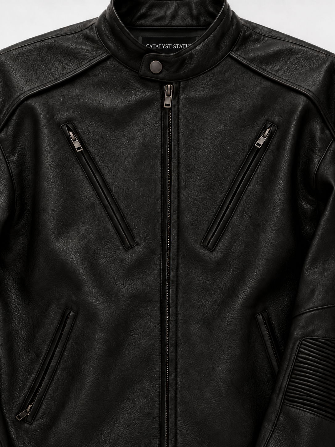 Rebel Moto Leather Jacket in Jet Black. Close-up of the snap collar, shoulder panels, and angled chest zips.