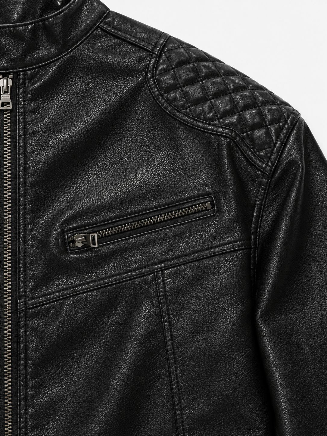 Monza Leather Jacket in Jet Black. Close-up of the quilted shoulder and zipped chest pocket.
