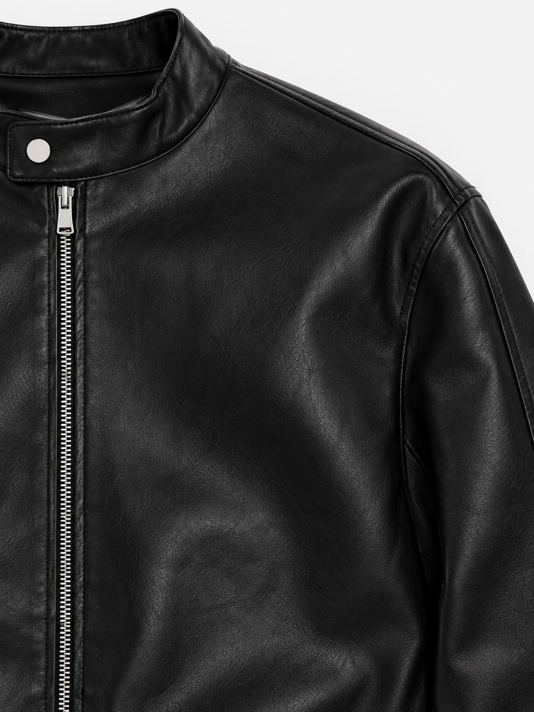 Racer Zipper Leather Jacket in Jet Black. Close-up of the snap stand collar, zipper, and shoulder seam.