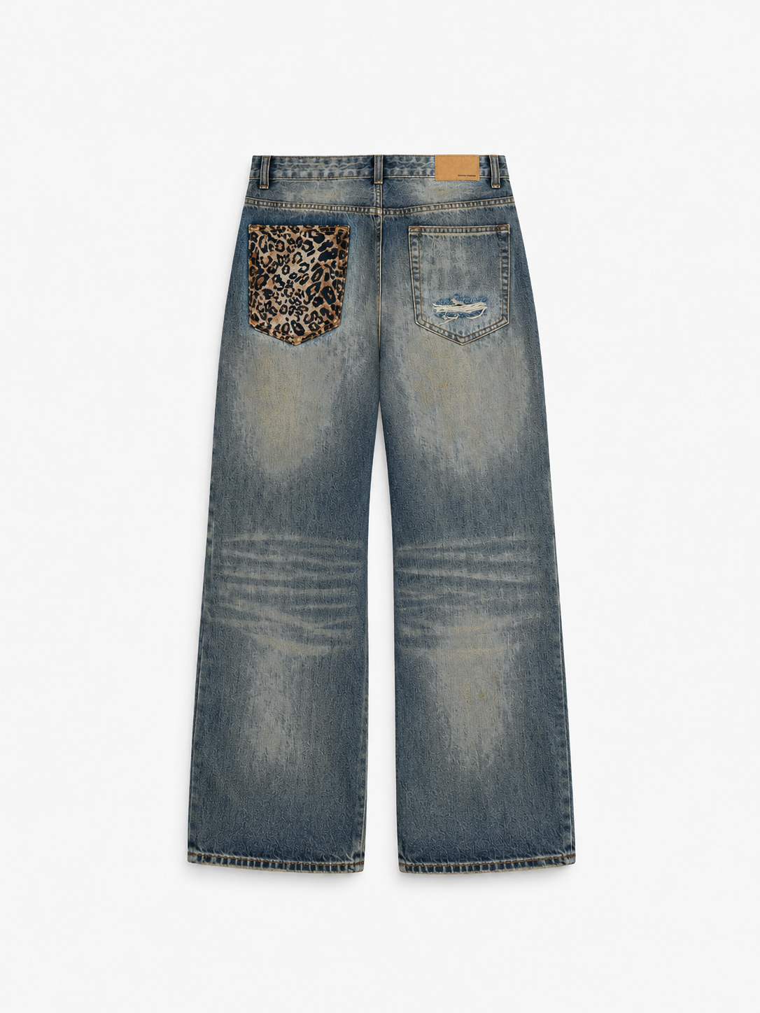 Distressed Baggy Jeans in Smoked Indigo. Back view, showing a cheetah-print rear pocket and distressed denim.