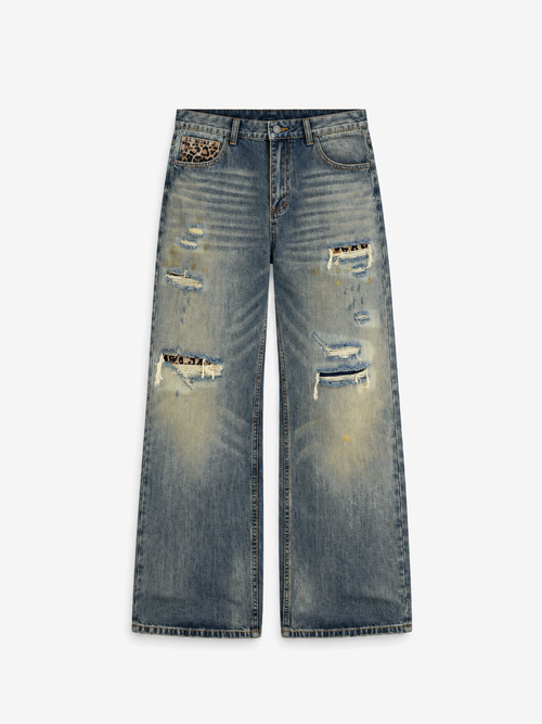 Distressed Baggy Jeans in Smoked Indigo. Front view, showing frayed rips and faded denim.