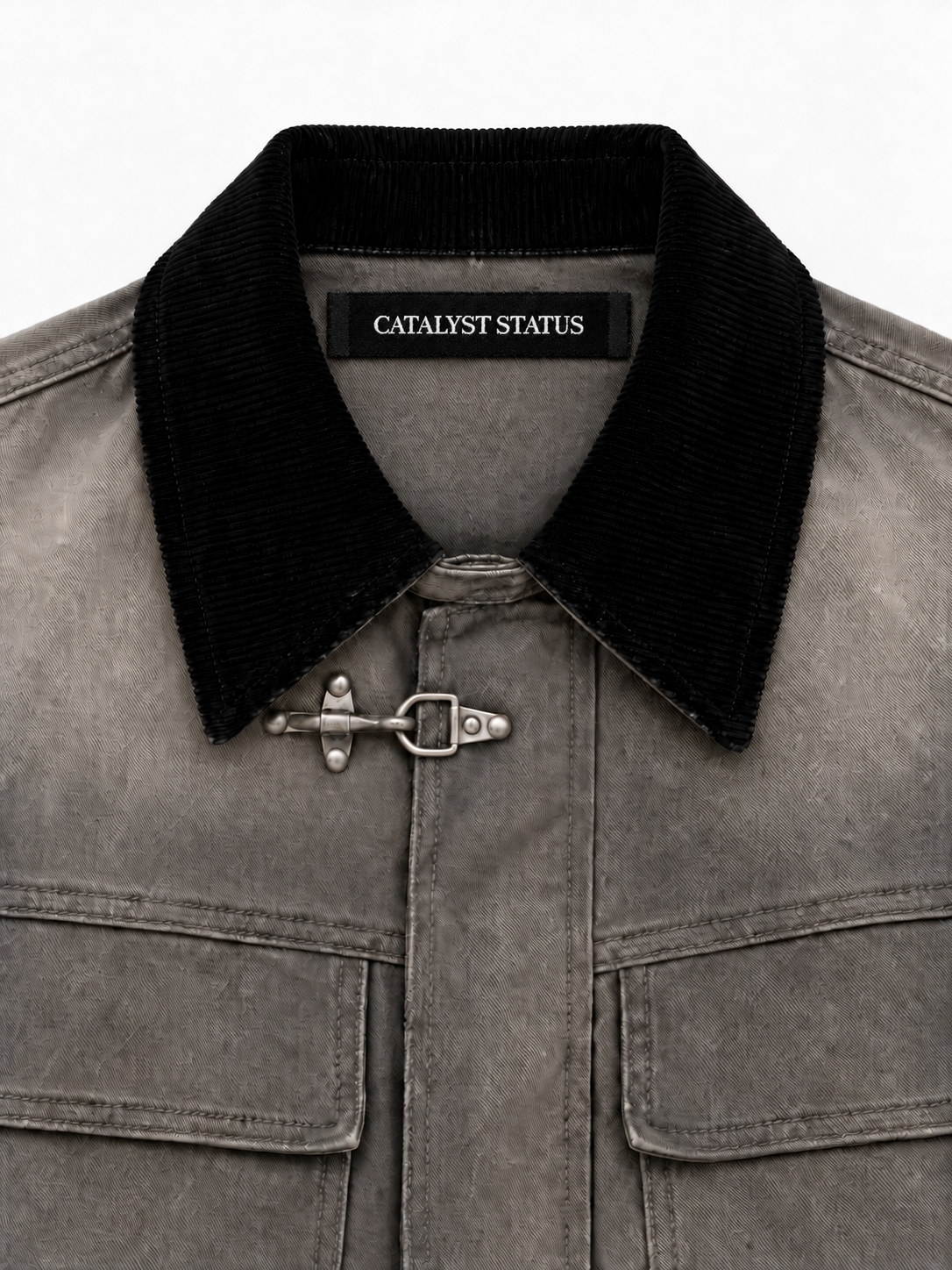 Foundry Clasp Denim Jacket in Fieldstone. Close-up of the contrast collar, silver clasp, and Catalyst Status label.